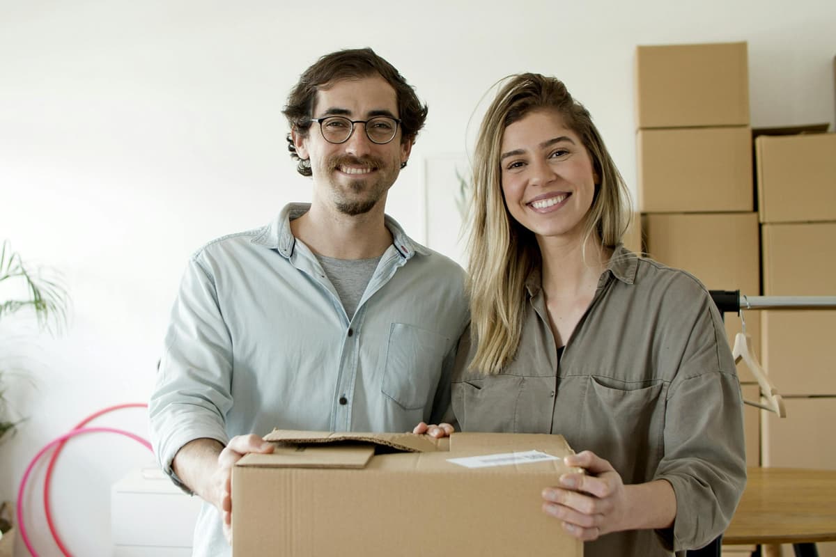 Happy couple moving after selling their house fast for cash